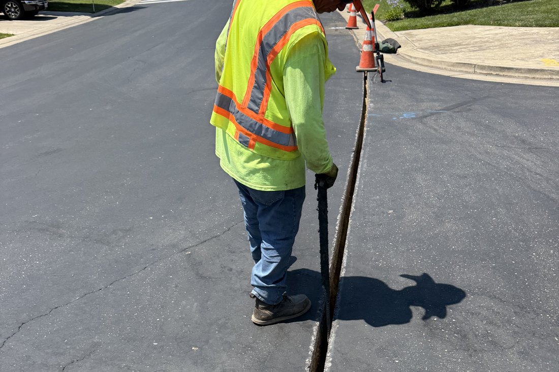 An Aspire Fiber crew microtrenching a residential street