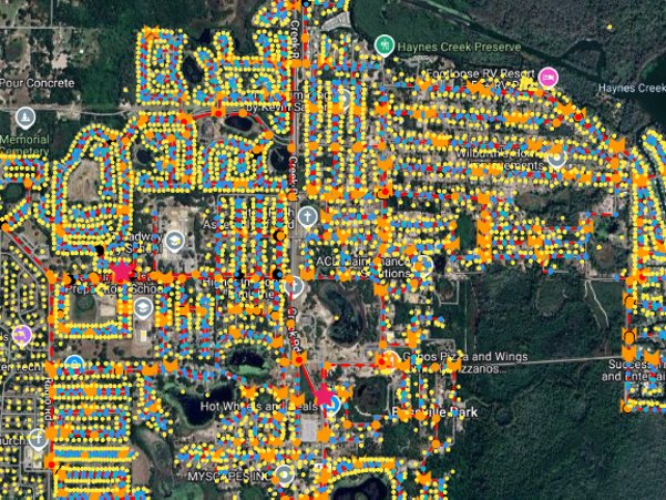 A serving-area plan: every home in a city dropped onto the map and colour-coded by which cabinet it will hang off