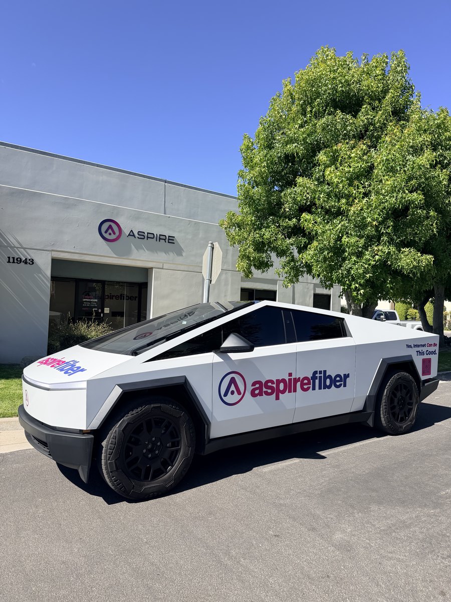 An Aspire Fiber wrapped Cybertruck parked
          in front of the Aspire office at 11943 in Moorpark